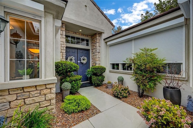 729 Sir James Bridge Way, Las Vegas, NV 89145 - doorway to property featuring stone siding and stucco siding