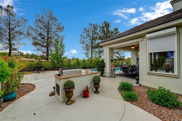 729 Sir James Bridge Way, Las Vegas, NV 89145 - view of patio / terrace with an outdoor kitchen