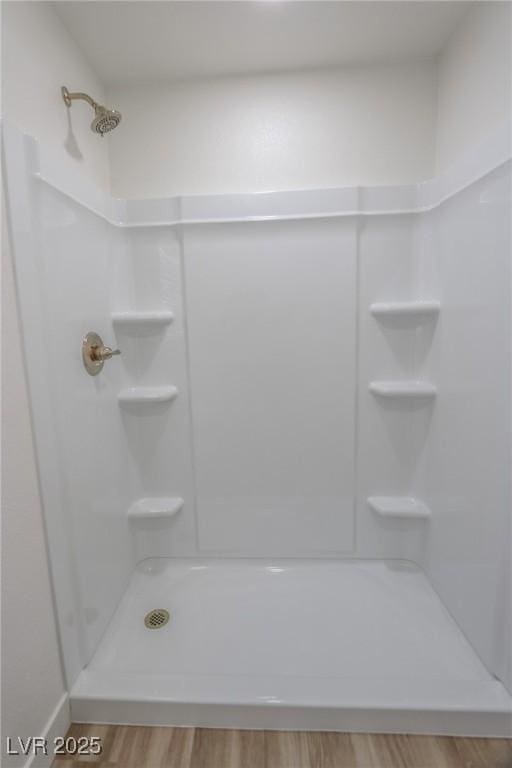 6842 Greengrove Dr, Las Vegas, NV 89103 - bathroom featuring a shower and wood finished floors