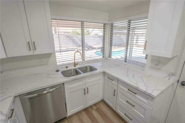 6842 Greengrove Dr, Las Vegas, NV 89103 - kitchen with dishwasher, a sink, and white cabinets