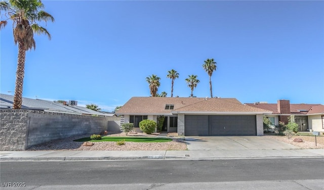 6842 Greengrove Dr, Las Vegas, NV 89103 - ranch-style house featuring an attached garage, fence, and concrete driveway