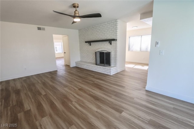 6842 Greengrove Dr, Las Vegas, NV 89103 - unfurnished living room featuring a ceiling fan, wood finished floors, baseboards, and a fireplace