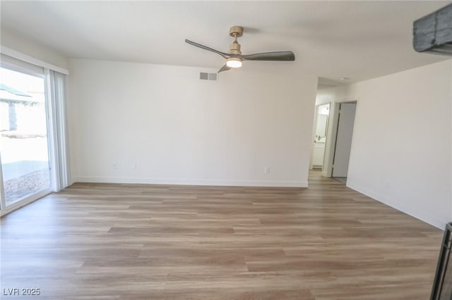 6842 Greengrove Dr, Las Vegas, NV 89103 - spare room featuring a ceiling fan, light wood-type flooring, and baseboards
