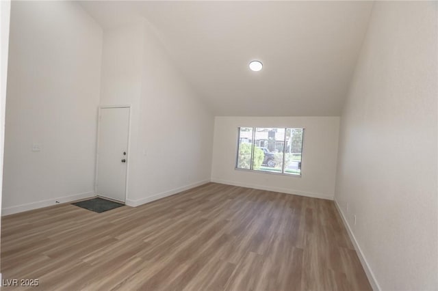 6842 Greengrove Dr, Las Vegas, NV 89103 - additional living space featuring vaulted ceiling, light wood finished floors, and baseboards