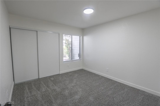 6842 Greengrove Dr, Las Vegas, NV 89103 - unfurnished bedroom with dark colored carpet, baseboards, and a closet