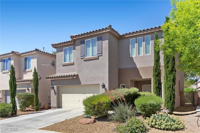 6049 Paddleboat St, North Las Vegas, NV 89031 - view of front of property with a tile roof, stucco siding, an attached garage, and driveway