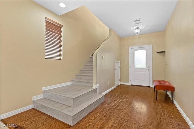 6049 Paddleboat St, North Las Vegas, NV 89031 - foyer featuring stairway, wood finished floors, and baseboards