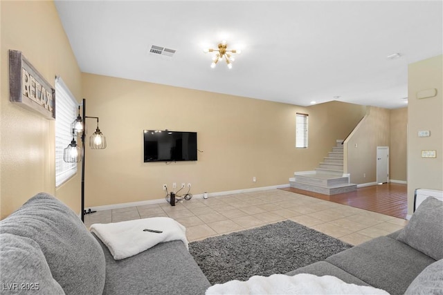 6049 Paddleboat St, North Las Vegas, NV 89031 - tiled living room with stairs and baseboards