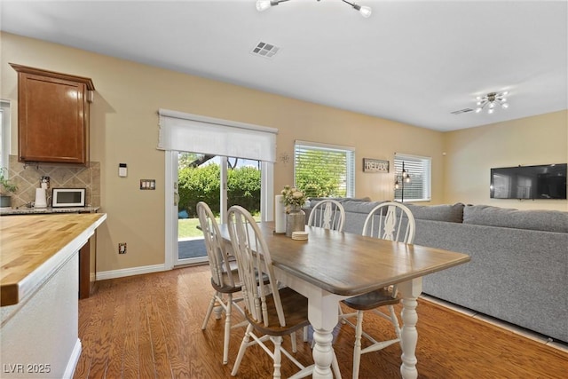 6049 Paddleboat St, North Las Vegas, NV 89031 - dining room featuring wood finished floors and baseboards