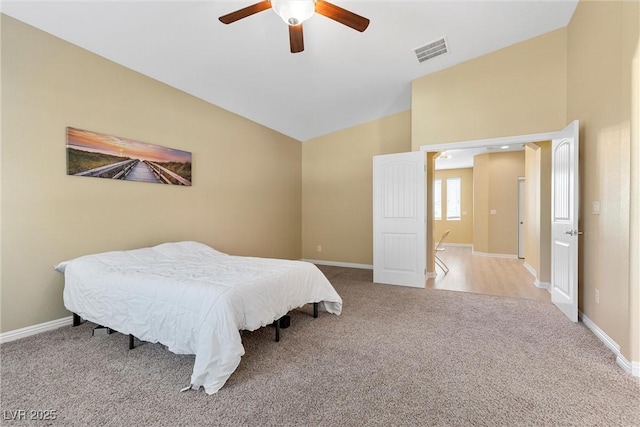 6049 Paddleboat St, North Las Vegas, NV 89031 - bedroom with vaulted ceiling, carpet floors, baseboards, and a ceiling fan