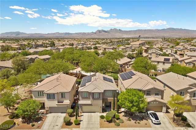 6049 Paddleboat St, North Las Vegas, NV 89031 - aerial perspective of suburban area with a mountain backdrop