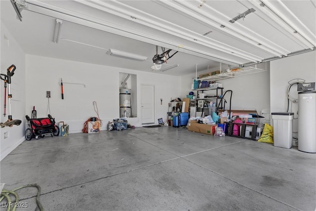 6049 Paddleboat St, North Las Vegas, NV 89031 - garage featuring water heater and a garage door opener