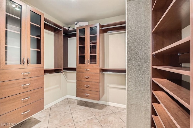 walk in closet featuring tile patterned floors