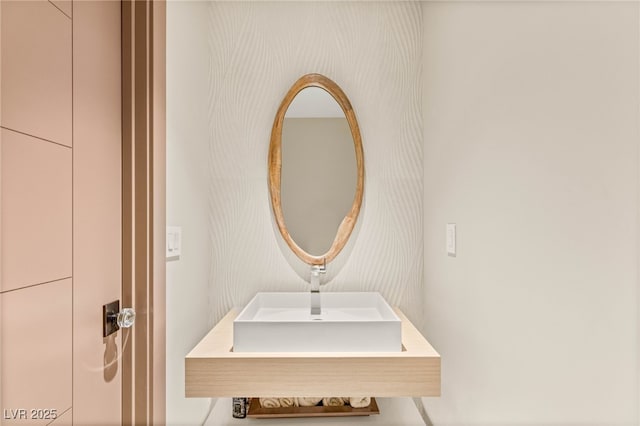 11453 Glowing Sunset Ln, Las Vegas, NV 89135 - bathroom view of wallpapered walls and a sink