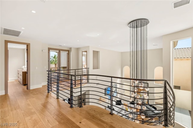 11453 Glowing Sunset Ln, Las Vegas, NV 89135 - hallway with an upstairs landing, light wood-type flooring, recessed lighting, and baseboards