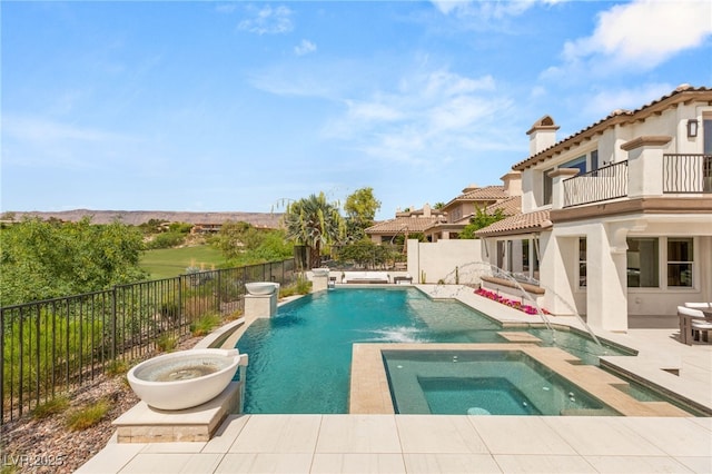 11453 Glowing Sunset Ln, Las Vegas, NV 89135 - view of swimming pool with a patio, a fenced backyard, and a pool with connected hot tub
