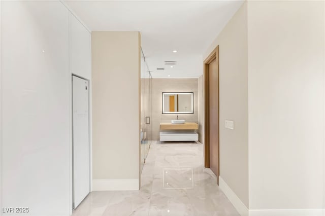 11453 Glowing Sunset Ln, Las Vegas, NV 89135 - hallway featuring baseboards and light marble finish floors