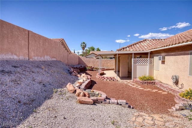 5441 Rose Hills St, Las Vegas, NV 89149 - fenced backyard featuring a patio