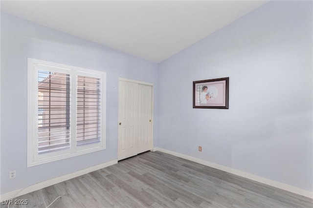 5441 Rose Hills St, Las Vegas, NV 89149 - unfurnished bedroom featuring wood finished floors, baseboards, and a closet