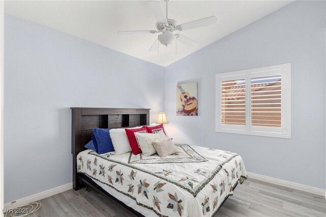 5441 Rose Hills St, Las Vegas, NV 89149 - bedroom with baseboards, wood finished floors, lofted ceiling, and a ceiling fan