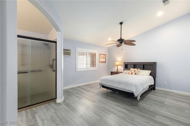 5441 Rose Hills St, Las Vegas, NV 89149 - bedroom with arched walkways, wood finished floors, baseboards, lofted ceiling, and a wall mounted AC