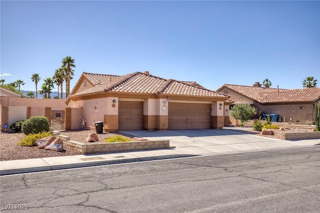 5441 Rose Hills St, Las Vegas, NV 89149 - view of front facade featuring stucco siding, a garage, a tiled roof, and driveway