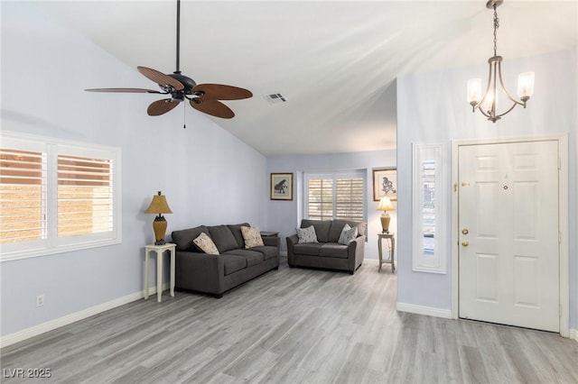 5441 Rose Hills St, Las Vegas, NV 89149 - living area with wood finished floors, ceiling fan, a chandelier, baseboards, and high vaulted ceiling