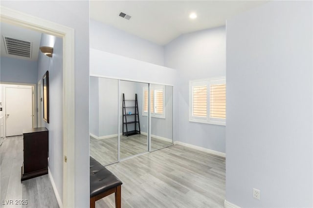 5441 Rose Hills St, Las Vegas, NV 89149 - unfurnished bedroom featuring wood finished floors, baseboards, high vaulted ceiling, a closet, and recessed lighting