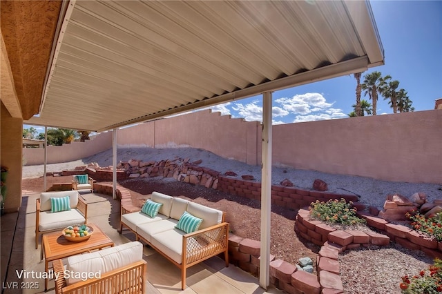 5441 Rose Hills St, Las Vegas, NV 89149 - view of patio / terrace featuring an outdoor hangout area and a fenced backyard