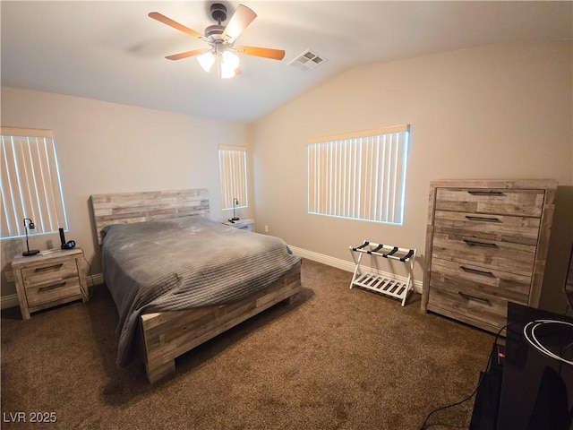 bedroom featuring vaulted ceiling, dark carpet, baseboards, and a ceiling fan