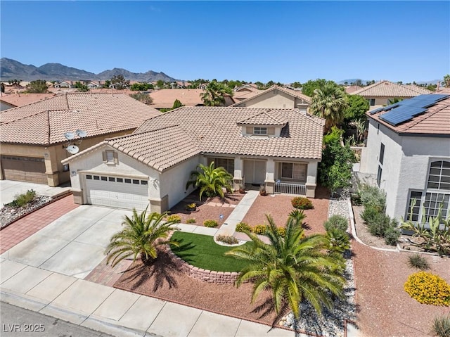 9282 W Viking Rd, Las Vegas, NV 89147 - mediterranean / spanish-style home with stucco siding, an attached garage, a tile roof, and concrete driveway