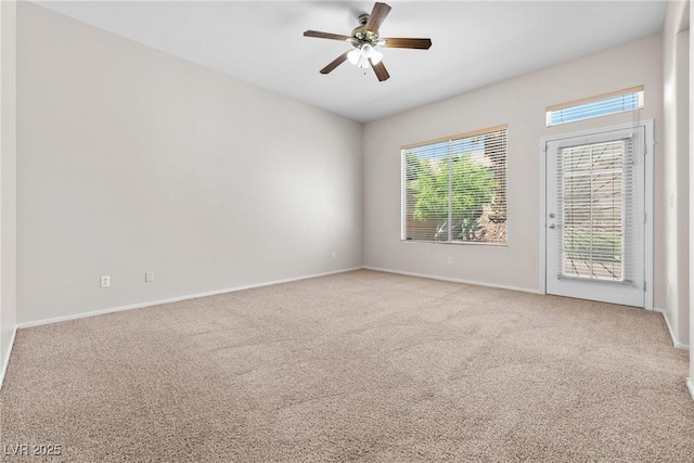 9282 W Viking Rd, Las Vegas, NV 89147 - empty room featuring light colored carpet, ceiling fan, and baseboards
