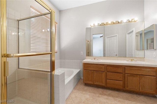 9282 W Viking Rd, Las Vegas, NV 89147 - bathroom with a garden tub, a shower stall, double vanity, and tile patterned flooring