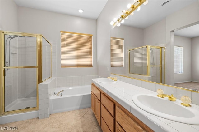 9282 W Viking Rd, Las Vegas, NV 89147 - full bath featuring a stall shower, tile patterned floors, a bath, and double vanity