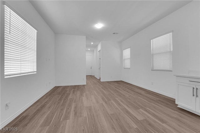 720 Webber Park St, Henderson, NV 89011 - unfurnished living room featuring light wood-style flooring and baseboards