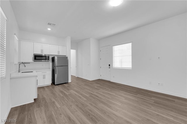 720 Webber Park St, Henderson, NV 89011 - kitchen featuring stainless steel appliances, a sink, baseboards, and recessed lighting
