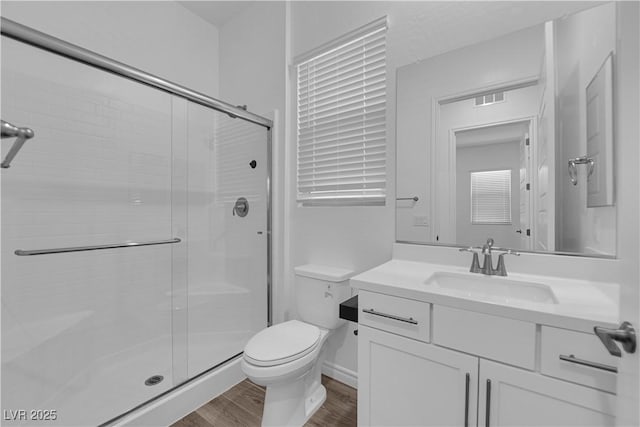 720 Webber Park St, Henderson, NV 89011 - full bath with a stall shower, toilet, wood finished floors, and vanity