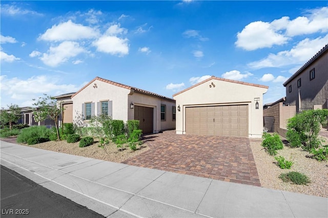 720 Webber Park St, Henderson, NV 89011 - mediterranean / spanish home with stucco siding, driveway, an attached garage, and a tile roof