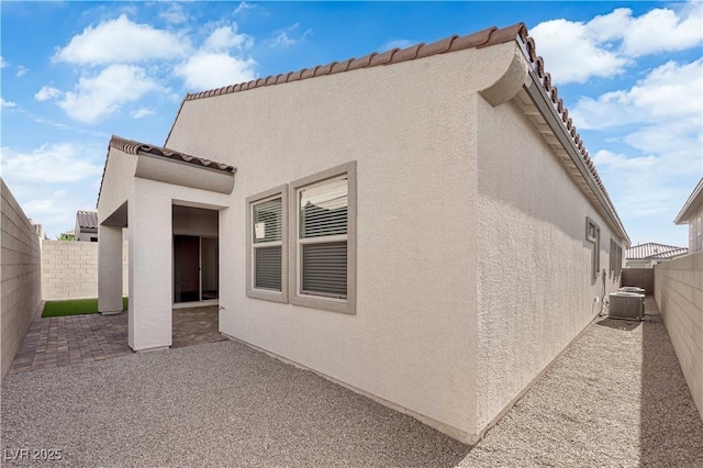 720 Webber Park St, Henderson, NV 89011 - view of side of home with stucco siding, a patio area, and a fenced backyard