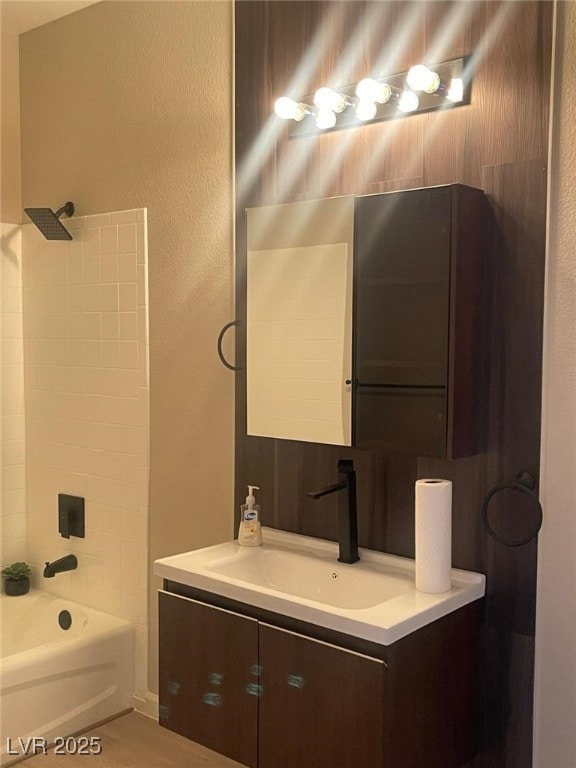 2151 Hussium Hills St Unit 207, Las Vegas, NV 89108 - bathroom with bathing tub / shower combination, vanity, and a textured wall