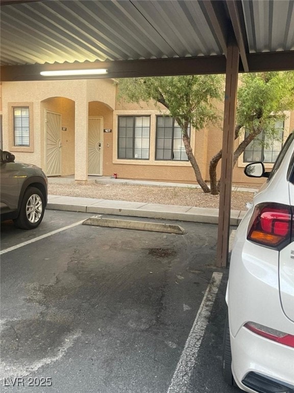 2151 Hussium Hills St Unit 207, Las Vegas, NV 89108 - view of partially covered parking lot