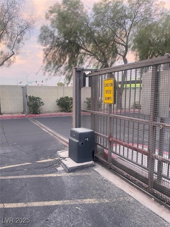 2151 Hussium Hills St Unit 207, Las Vegas, NV 89108 - gate at dusk featuring fence