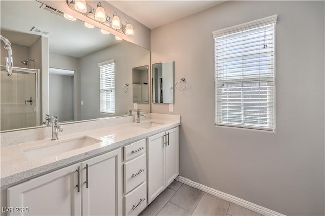 1201 Seaboard Ct, Henderson, NV 89002 - bathroom with a stall shower, baseboards, double vanity, and tile patterned floors