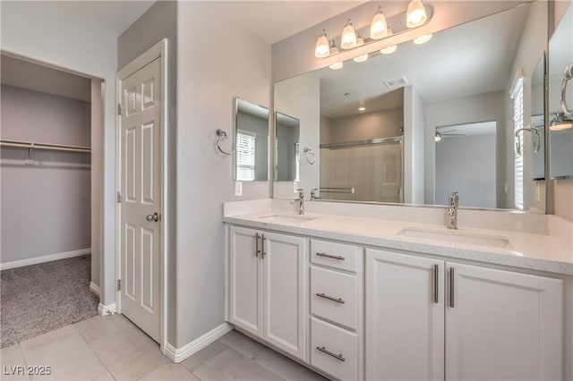 1201 Seaboard Ct, Henderson, NV 89002 - full bath featuring ceiling fan, a shower stall, double vanity, and baseboards