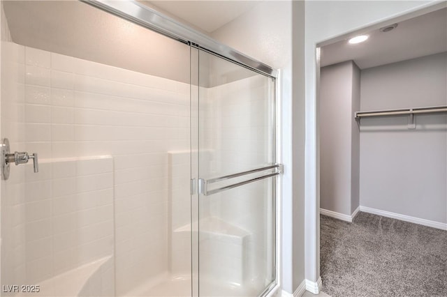 1201 Seaboard Ct, Henderson, NV 89002 - bathroom with a shower stall, baseboards, a walk in closet, and recessed lighting