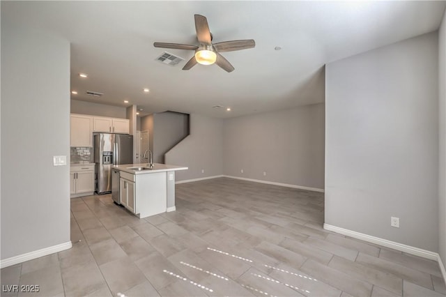 1201 Seaboard Ct, Henderson, NV 89002 - kitchen featuring stainless steel appliances, a ceiling fan, a sink, open floor plan, and baseboards