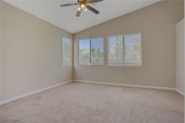unfurnished room featuring a ceiling fan, light colored carpet, baseboards, and lofted ceiling