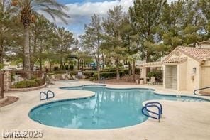 community pool with a patio and a pergola