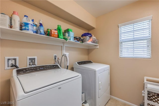 clothes washing area with independent washer and dryer