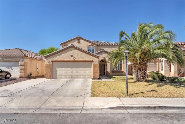 2104 Spanish Town Ave, North Las Vegas, NV 89031 - mediterranean / spanish-style house featuring a garage, driveway, stucco siding, a tile roof, and a front yard